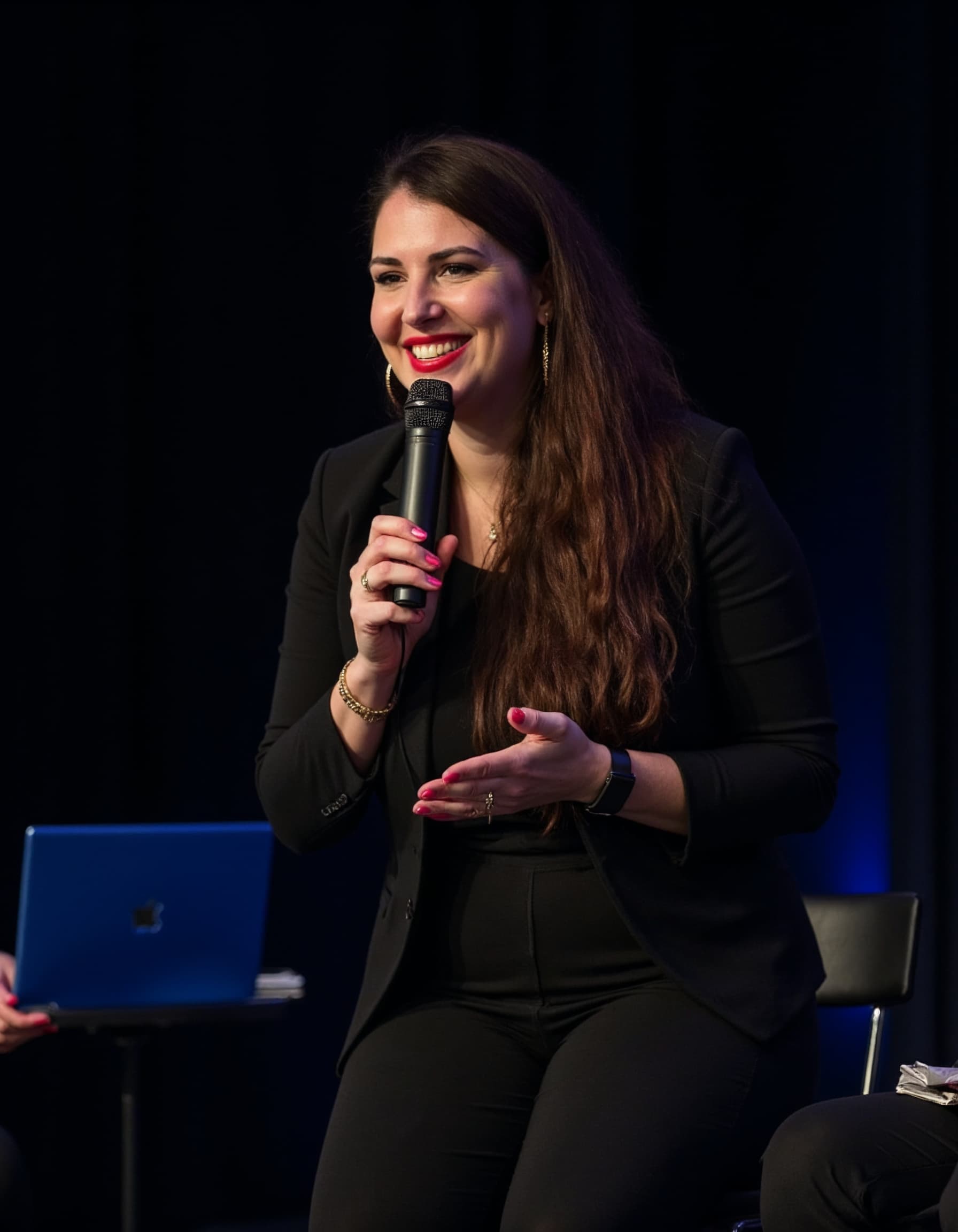 Jana Affum speaking, microphone in hand